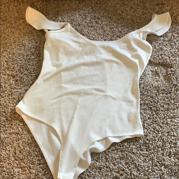 Charlotte Russe Tops - White body suit with ruffle sleeve